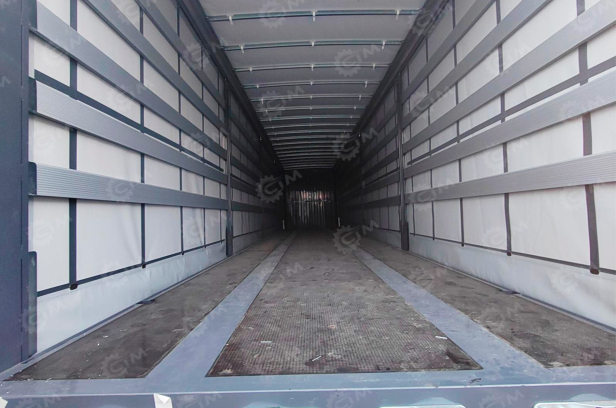 Полуприцеп шторка LUXUDA 3 оси FUWA, пневмоподвеска, 40 тонн, ленивая передняя ось ССУ 1350, 16000*2550*3980. Фото 3