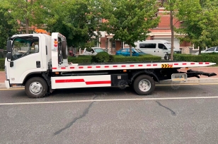 Эвакуатор на шасси ISUZU 4x2 дв 87Kвт гп 3т сдвижная платформа лебёдка подъёмный механизм. Фото 2