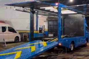 Крытый эвакуатор с движной платформой на шасси ISUZU 4x2 дв 138Kw гп 5т. Фото 1